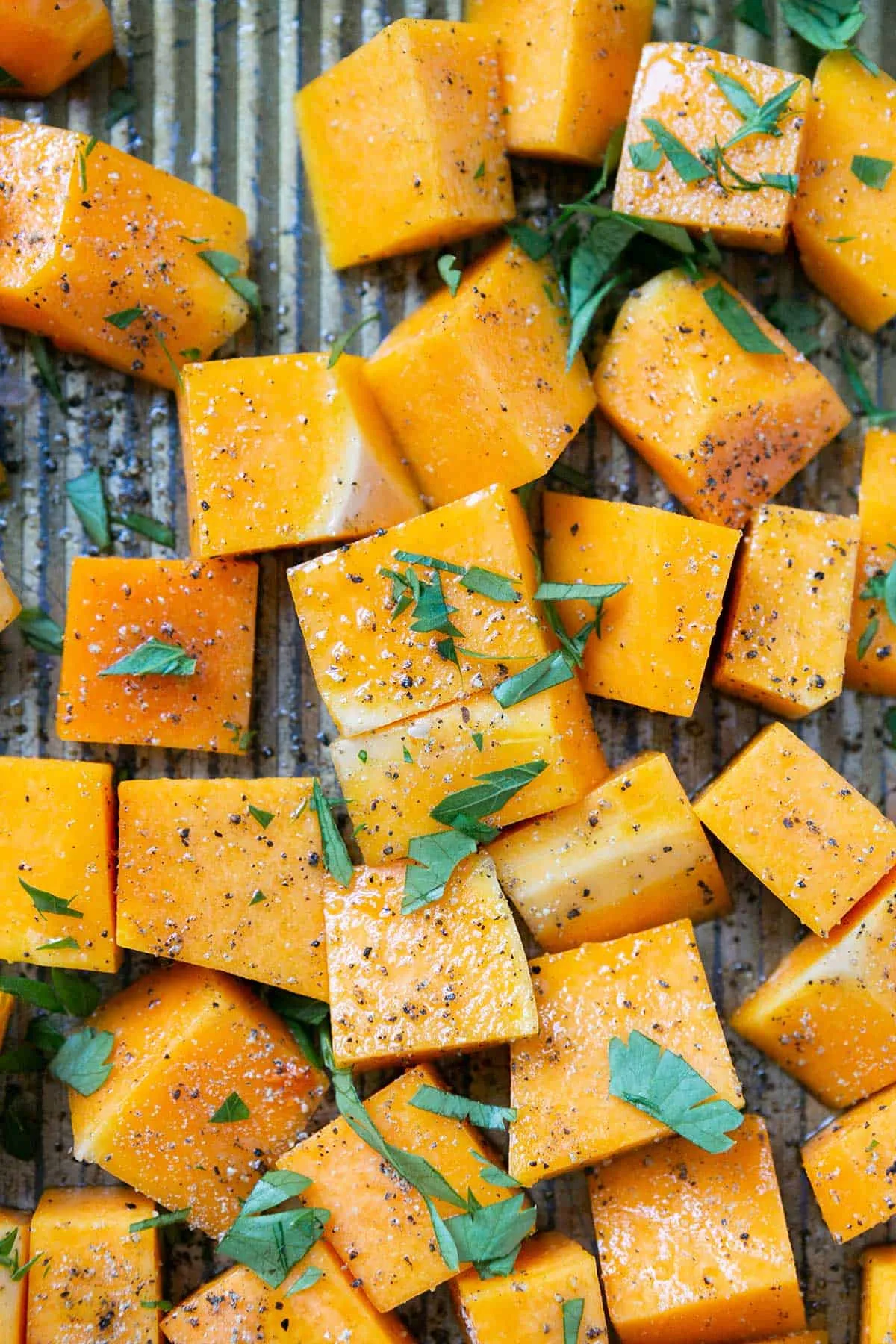 butternut squash cubes on baking sheet