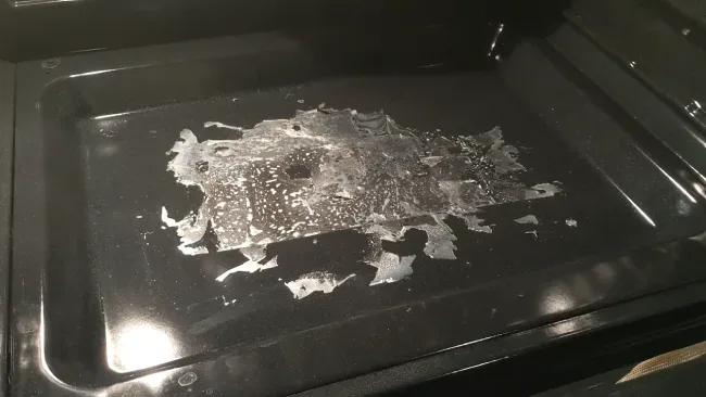 how to clean plastic from oven