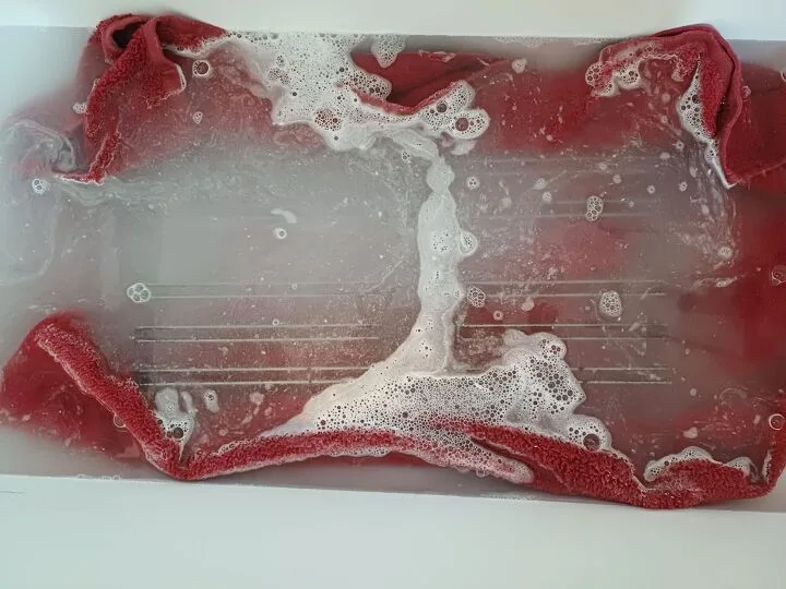 oven rack soaking in bathtub